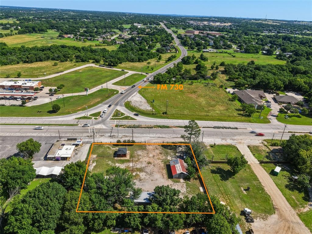 Prime commercial 1 acre lot located next to the infamous Malt Shop.  Located minutes from I-20, nearby booming commercial growth, and halfway between Weatherford downtown and Hudson Oaks. At the corner of Fort Worth Hwy and FM 730 (Azle Hwy), this location captures over 25,000 vehicles passing by per day.  Key improvements include**1 acre fenced lot**400 square foot office with restroom**1500 square foot workshop**covered parking awning**2 welding stations wired for 220 amps**.  Opportunities for any commercial use zoned as C1, with a gross market rental rate opportunity of $4000 or more per month.