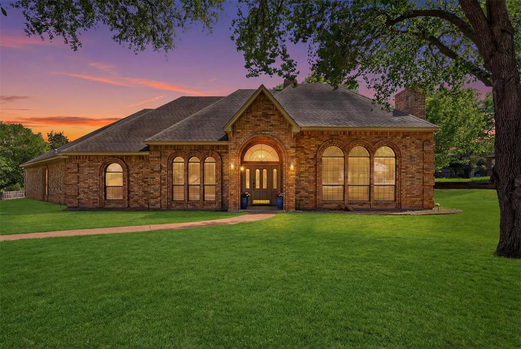 Beautifully maintained custom single story home set on nearly one acre in the sought after, wooded Cross Timber Hills community, zoned to highly acclaimed Carroll ISD. Thoughtfully designed with a bright, open layout and soaring ceilings, this home offers both comfort and functionality.
The oversized primary suite serves as a private retreat, complete with a versatile sitting area, perfect for a home office, fitness space, or cozy reading nook. Secondary bedrooms are tucked away in a separate wing, each featuring walk-in closets to provide privacy and convenience. At the heart of the home, the kitchen is well-appointed with granite countertops, stainless steel appliances, abundant cabinetry, and a charming breakfast nook, seamlessly connecting to the main living area. Step outside to an expansive backyard shaded by mature trees and enhanced with a sprinkler system, offering endless possibilities for a future pool or custom outdoor living space. Additional highlights include two HVAC units replaced in 2022 and an oversized three-car garage with epoxy floors. Ideally located just minutes from premier dining, shopping, and DFW International Airport.