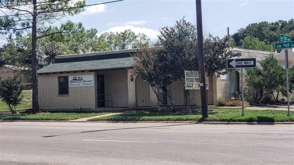 Prime Commercial Opportunity in the Heart of Mineral Wells!
Are you ready to elevate your business presence in Mineral Wells? Consider 711 SW 1st Street, a versatile office building that blends functionality, visibility, and charm in one of Mineral Wells’ most accessible locations. Built in 1967 this 2,032 sq ft brick property sits on a corner lot just steps from downtown, offering high visibility  with main road frontage and easy access for clients and staff alike with ample parking. Previously a Physical Therapy facility.

Property Highlights:

Size: 2,032 sq ft on a 0.115-acre lot

Style: Professional office space with flexible layout

Construction: Brick exterior, flat fiber roof

Interior: Carpet and ceramic tile flooring, central heating and air

Accessibility: Ramp access  entrance and 8–10 ft ceilings

Parking: Asphalt lot 

Whether you're launching a medical practice, legal firm, creative studio, or professional service, this space adapts to your vision. Zoned for commercial use and located in the College subdivision, it’s surrounded by other thriving businesses and just minutes from the Crazy Water Hotel and downtown attractions.

Why 711 SW 1st Street?
Strategic location with good traffic counts
Turnkey office setup
Ideal for owner-occupants or investors