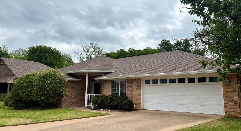 Ideally located near Harbor Lakes, this well-maintained home offers comfort, convenience, and versatility. Close to shopping, dining, Highway 377, and the historic Granbury Square, the central location makes everyday living easy. The open floor plan features a desirable split-bedroom layout for added privacy. One wing includes a spacious secondary bedroom with three closets, plus a nearby full bath, linen closet, and coat closet. The opposite wing hosts the primary suite with an ensuite bath and walk-in closet. A bonus room provides flexible space for a home office, craft or sewing room, or other creative use. Lovingly cared for over the years, this property also presents an excellent opportunity for a low-maintenance rental investment.  Washer, dryer, and refrigerator will convey with the property.