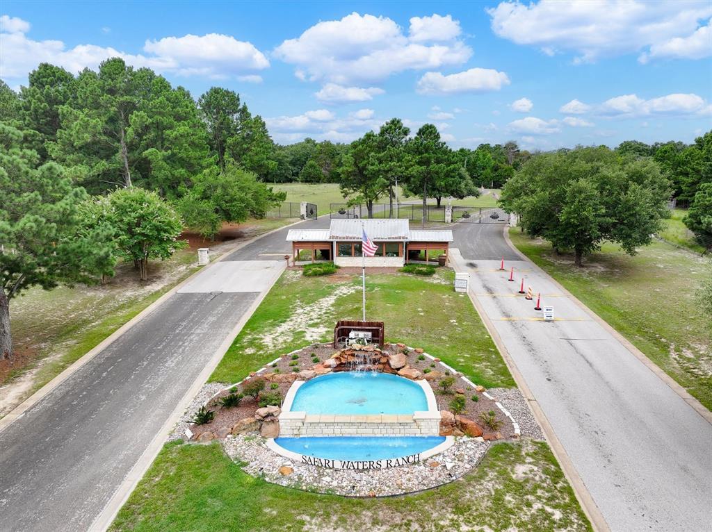 Welcome to Safari Waters Ranch, a secluded, gated community offering a truly unique East Texas experience. This 2-acre wooded lot offers the potential for beautiful water views once selectively cleared, providing the perfect setting for your dream home or weekend retreat.

Safari Waters Ranch spans 1,775 acres of unspoiled nature with three spring-fed lakes totaling 130 acres, fully stocked with bass, catfish, crappie, and bream. Wildlife lovers will enjoy the rare opportunity to live among free-roaming exotic animals, including Zebra, Axis Deer, Fallow Deer, White-tailed Deer, and Père David's Deer.

Property owners have exclusive access to Camp Safari RV park with 28 full hookups, a pavilion, and restrooms for you and your guests. Additional amenities include fishing docks, boat ramps, and lakeside picnic and grill areas- perfect for weekend relaxation or entertaining.

Located just 90 minutes from Dallas, this property combines privacy, nature, and convenience. Plus, enjoy the benefit of very low property taxes thanks to the community’s wildlife exemption. Whether you're building a home, creating a peaceful escape, or investing in land, this property offers something special.