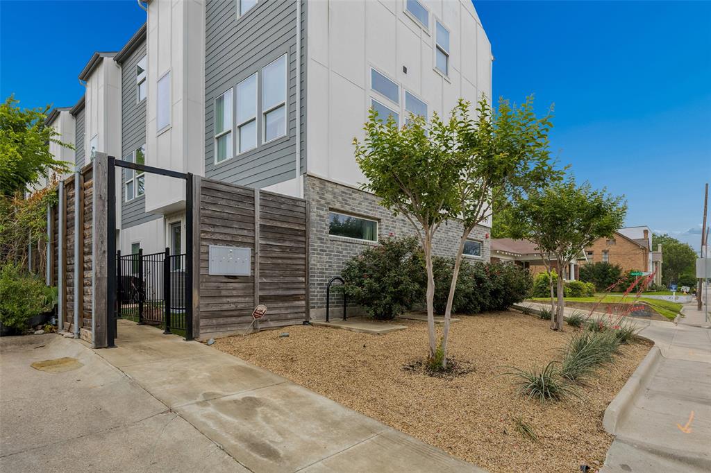 Built in 2022, 5647 Live Oak offers a rare opportunity to own nearly new construction in the heart of East Dallas—an increasingly hard-to-find advantage among the area's predominantly older housing inventory. Located minutes from Lakewood & Lower Greenville, this three-story townhome-style condo combines modern design, energy-efficient construction, and low-maintenance living in one of Dallas' most connected neighborhoods. Inside, real hardwood floors, abundant natural light, & open-concept layout create a bright, contemporary feel. Designer kitchen features quartz countertops, stainless steel appliances, ample cabinetry, & built-in storage. Both spacious bedrooms include vaulted ceilings, custom closets, and beautifully appointed ensuite baths. Bonus room on the ground floor provides exceptional flexibility as a dedicated home office, guest room, fitness space, or 3rd bedroom. Additional storage in the garage which is also pre-wired for electric vehicle charging, offering future-ready convenience for EV owners. Outside, enjoy a fenced front yard and secured pedestrian gate that enhance privacy and ease of access. Lock-and-leave living without compromise—modern, efficient, and ideally located. One of five available units.