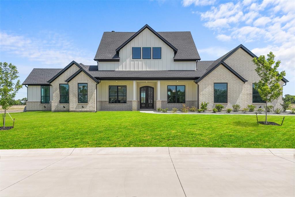 This is the one you've been waiting for! Beautiful custom modern home offering the perfect blend of peaceful country living and contemporary luxury. Situated on over an acre in the award-winning Caddo Mills ISD, this stunning new construction boasts more than 2,700 square feet of thoughtfully designed living space. Featuring 4 spacious bedrooms, 3 and a half bathrooms, & a dedicated study, this home was designed with both comfort and functionality in mind. From the moment you step inside, you'll be captivated by the vaulted ceilings with accent wood beams, abundant natural light, and impressive open-concept design. The seamless flow between the living, dining, and kitchen areas creates the ideal setting for everyday living and unforgettable gatherings. At the heart of the home is a show-stopping Chef's kitchen featuring gorgeous quartz countertops, an oversized island perfect for entertaining, and an abundance of cabinetry that offers both beauty and practicality. Whether you're hosting family and friends or enjoying a quiet evening at home, this space was designed to impress. Step outside and discover a huge backyard with endless possibilities. With over an acre of land, there's plenty of room to build the pool you've always dreamed of, add a workshop or shop, create an outdoor entertaining oasis, or simply enjoy the privacy and wide-open Texas skies. Offering the space, style, and quality today's buyers are searching for, this exceptional home is the perfect place to put down roots and create lasting memories.