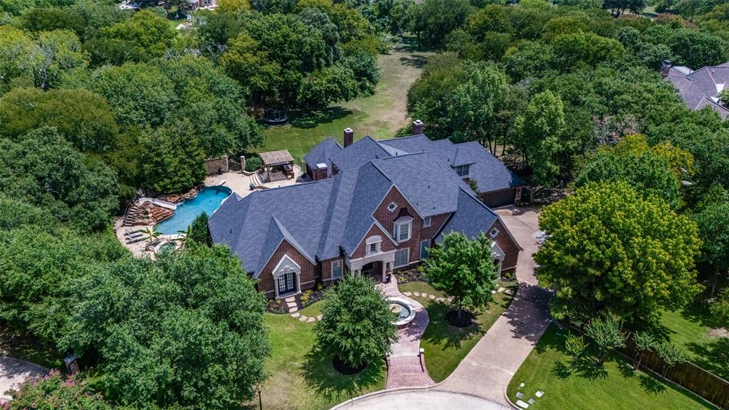 RARE OPPORTUNITY! ONE OF SOUTHLAKE'S MOST PRESTIGIOUS GATED NEIGHBORHOODS! UPDATED ELEGANT STUNNING HOME, RESORT STYLE PRIVATE BACK YARD WITH WATERFALL POOL, slide and diving board, spa, built-in grill, fish pond-waterfalls, chef style kitchen, Sub-Zero-wine fridge, Wolf range, steam oven, built-in Miele coffee maker, Cristallo Quartzite counter top, marble, hardwoods, built-ins, 4 Fireplaces, screen porch w-soaring ceiling and fireplace. Master Suite-main level, 6 Bed-7 Bath, executive office, library, sunroom, game room, guest suite-main level. Oversized 4+car garage-epoxy, home backs up to green space, professionally lit front and back. Home fully equipped with Creston Home Smart System that you can operate from your smart device. Neighborhood has walking trails-park-tennis courts. Minutes from AWARD WINNING schools, parks, shopping, restaurants and only approx-15 minutes to DFW airport. New carpet just installed upstairs. DON'T MISS THIS OPPORTUNITY!