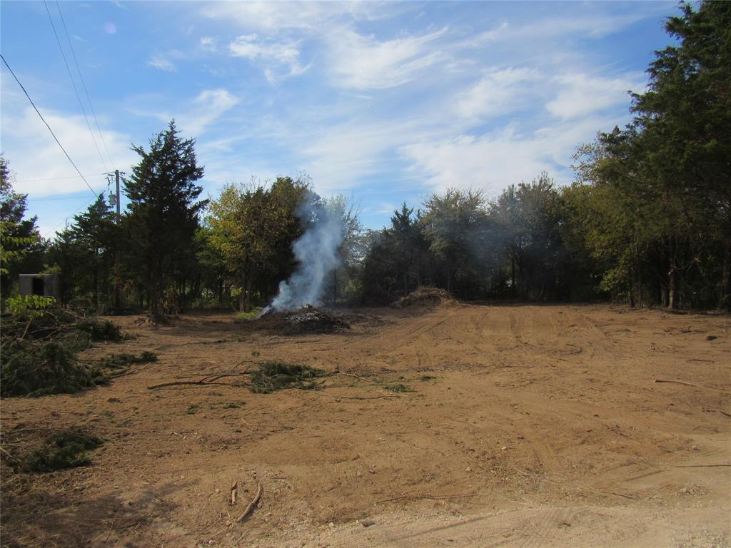 If you are on the hunt for the perfect place for you RV for the weekends, you may have just found it! MOBILE HOME, RV LIBING, MAYBE A TINY HOME,TINY HOME.   This is a great lot for building, developing, making your own personal lake home or POSSIBLY set up for additional RV's for you and your friends!  Could also use for party pavilion, one of the few areas left to be able to bring in a mobile home to live in.  Clearing the brush and small trees, this is yours for the imagination!  GOLF CART RIDE TO PELICANS LANDING, LESS THAN 5 MIN TO CEDAR BAYOU, CEDAR MILLS MARINA, JUNIPER POINT AND MEGASTAR CASINO. The public beach and park access for Sherwood Shores is a 5 min golf cart ride to a beautiful beach on Lake Texoma.  Water and electric not connected, septic will be required.