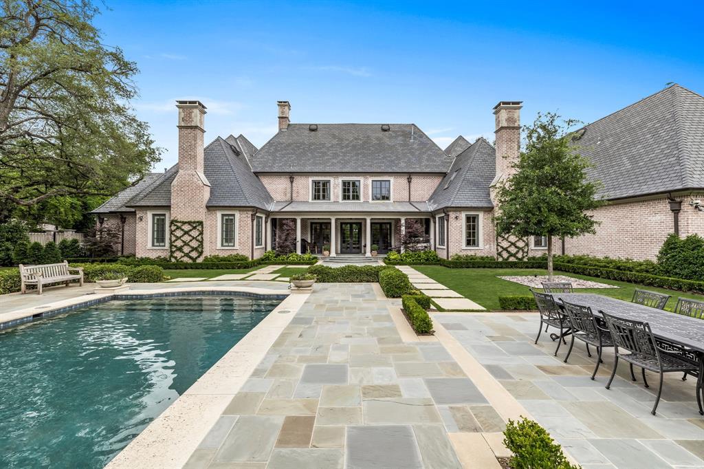 The epitome of refined living, this home is nestled within the prestigious enclave of Preston Hollow. Private & exclusive, this gated home draws you in with its manicured landscape & stately facade. Inside, you'll find sophistication & timeless charm. Expansive living spaces adorned with fine finishes, from the soaring ceilings to the exquisite millwork, handsome study, & hardwoods. The gourmet kitchen is a culinary masterpiece, featuring top-of-the-line appliances, custom cabinetry, and sprawling countertops, perfect for both intimate gatherings and grand entertaining, as it opens into a spacious breakfast room and family room. Retreat to the downstairs primary suite, where tranquility abounds. Centered around an impressive fireplace, the room features tall, coved ceilings, living space, and two ensuite bathrooms. Upstairs are 5 bedrooms, a game room, media room, & gym. The backyard is a true haven of fun & relaxation with a large pool, covered porch & ample space to lay out & enjoy.