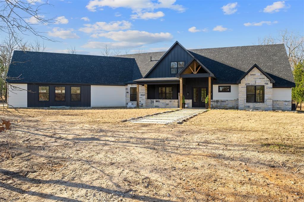 Motivated Seller! $15,000 in seller concessions towards closing costs. Completed in 2023 this exceptional custom residence presents a rare opportunity to secure immediate equity while enjoying refined acreage living. Situated on over five beautiful acres, the property blends modern luxury with the privacy and serenity of a secluded country setting.

A tranquil private pond, horse stable, and partially cleared grounds surrounded by mature trees create a peaceful retreat with endless possibilities. The setting offers both openness and seclusion — a combination rarely found in newer construction.

Inside, the thoughtfully designed layout features four bedrooms and three and a half bathrooms, anchored by a spacious open-concept living area ideal for both everyday comfort and elevated entertaining. The primary suite is privately positioned on the main level, offering a quiet sanctuary with generous proportions and refined finishes. Soaring ceilings and expansive windows fill the home with natural light, enhancing its sophisticated yet welcoming atmosphere.

An oversized three-car garage provides ample space for vehicles, storage, or recreational equipment, while the surrounding acreage allows for equestrian use, outdoor living enhancements, or future expansion — all without compromising privacy.

This is a unique offering that combines new-build quality, immediate equity potential, and the tranquility of private acreage living — all within convenient reach of modern amenities. A rare opportunity for those seeking space, discretion, and elevated living.