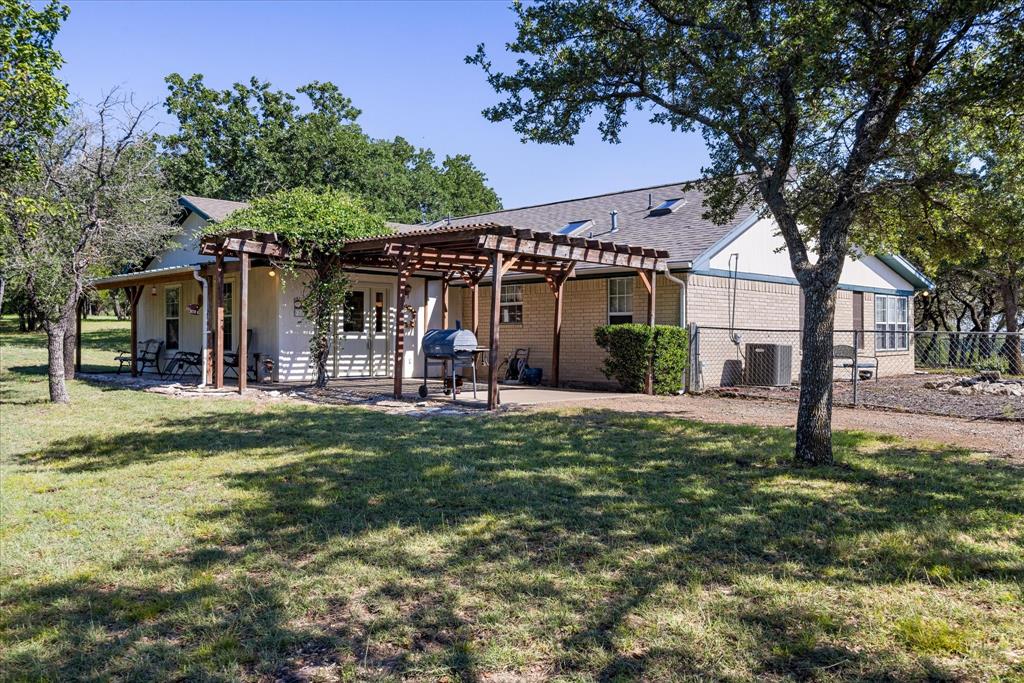 Discover the perfect blend of privacy, scenery, and Texas charm on this stunning 19.114-acre property in Lipan. The land is beautifully manicured across approximately 9 acres, showcasing more than 100 mature oak trees with mesquite scattered throughout, creating a park-like setting that feels peaceful and intentional. The western exposure offers an extraordinary, unobstructed view across hundreds of acres, delivering sunsets that are nothing short of spectacular
The property includes a comfortable 3-bedroom, 2 bath home  featuring two living areas and a bright sunroom that brings the outdoors in. Whether you’re looking for a full-time residence, a weekend retreat, or a place to expand and build, this home provides a warm and functional foundation.

A three-car detached metal garage and workshop adds valuable storage, workspace, and flexibility for equipment, hobbies, or ranch needs. With its rolling terrain, mature trees, and wide-open views, this property offers the rare combination of usable land, natural beauty, and true Texas tranquility.

This is the kind of place where you can breathe, spread out, and enjoy the land yet still be within easy reach of Lipan, Granbury, Weatherford, and the surrounding communities. A remarkable opportunity to own acreage with views that feel endless.