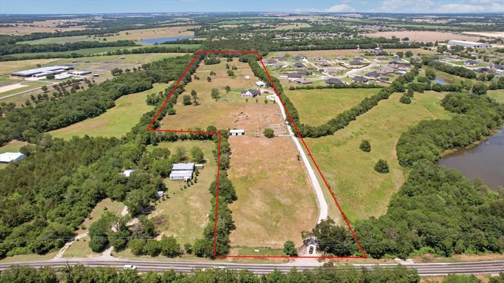 Investor, Rancher, or Developer’s Dream in West Van Alstyne!
25 rolling acres with mature trees, a serene pond, and breathtaking views with Tudor-style home in the highly sought-after location right in the path of growth nestled among multiple new residential developments. The property’s prime FM 121 frontage ensures excellent visibility and access, while its current AG exemption provides valuable tax advantages. Whether you’re looking to develop into a premier residential community, create a boutique ranching operation, or secure a long-term buy-and-hold investment in one of North Texas’ fastest-growing corridors, this property checks every box. Just under an hour from Love Field and DFW International Airport, this location offers the perfect balance of rural charm and urban convenience. Continue its current life as a working cattle ranch, or capitalize on the tremendous development potential for future appreciation.