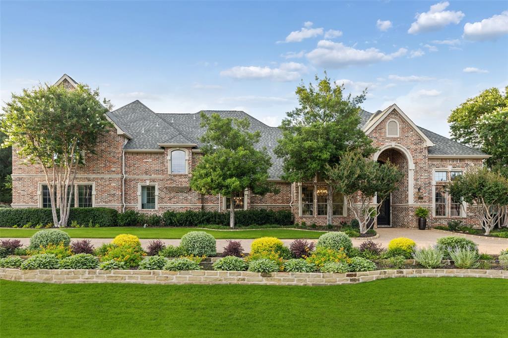 Set behind mature trees on a beautifully manicured one-acre homesite in the prestigious Emerald Bay, this exceptional estate delivers the rare combination of refined luxury, privacy & resort-inspired outdoor living. Thoughtfully reimagined with extensive updates throughout, every space has been curated to offer effortless elegance & everyday comfort. A grand arrival welcomes you inside, where rich hand-scraped hardwood floors, designer lighting & walls of windows create a warm yet sophisticated atmosphere filled w-natural light. Beautifully appointed chef's kitchen featuring double ovens, leathered granite countertops, custom cabinetry + an expansive butler's pantry. Private primary retreat is a sanctuary of its own, offering a serene sitting area, a luxurious spa-inspired bath, oversized dual-head shower, granite vanities, designer finishes + an impressive WIC complete with a dedicated cedar closet. Separate guest suite on the main level provides exceptional accommodations for family or visitors. Upstairs, entertainment takes center stage with an expansive game room, dedicated media lounge & a thoughtfully designed theater kitchenette complete w-sink, microwave, fridge & custom cabs, perfect for movie nights & hosting on any scale. Step outside & experience what truly sets this property apart. Designed to rival a private resort, the backyard unfolds into a spectacular outdoor oasis featuring a beach-entry pool accented by waterfalls, lush landscaping, extensive hardscape, upgraded landscape lighting + multiple gathering spaces. The oversized covered living area, outdoor kitchen, pergola w-fireplace & firepit lounge create the ultimate setting for year-round entertaining. Oversized four-car garage with epoxy flooring. Meticulously maintained & enhanced with numerous recent improvements, including Nest thermostats, upgraded appliances, tankless water heaters, surge protection + extensive interior & exterior updates.