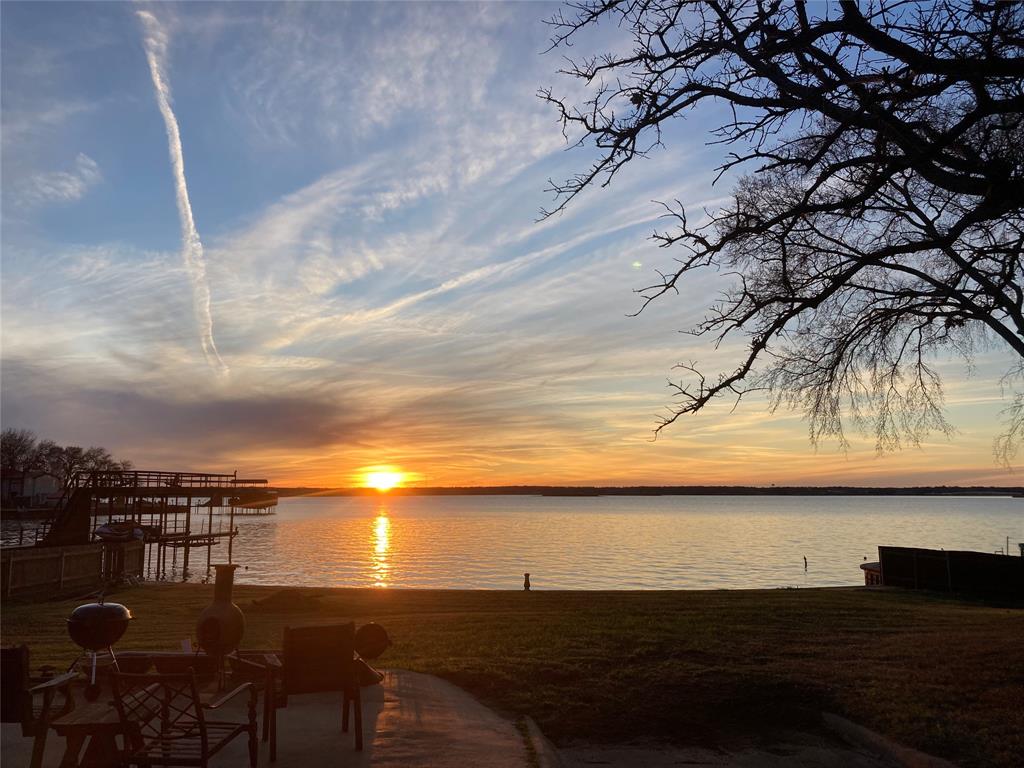 Land of Opportunity on sought-after Cedar Creek Lake! Rare chance to own 2 waterfront lots with approximately 101’ of platted shoreline in the heart of Gun Barrel City offering HUGE open water views and unforgettable sunset evenings. Tear down and create your dream lakefront retreat with room to spread out, or rejuvenate the existing home and add guest quarters for the ultimate family compound or weekend getaway.

The property offers an incredible street-to-water setting with a long paved driveway leading through mature trees to the waterfront. The design-friendly lot shape and depth provide endless possibilities for a custom build, outdoor entertaining spaces, pool, additional structures, or expansive lakeside living. Enjoy a great protected bay location with sweeping western-facing views across the main body of the lake.

Existing improvements include an old house,- some say tear it down, detached storage shed, fenced areas, and waterfront yard ready for your vision. Whether you are looking for an investment opportunity, redevelopment project, or your own private lakefront escape, this is a rare opportunity to create something special on Cedar Creek Lake.