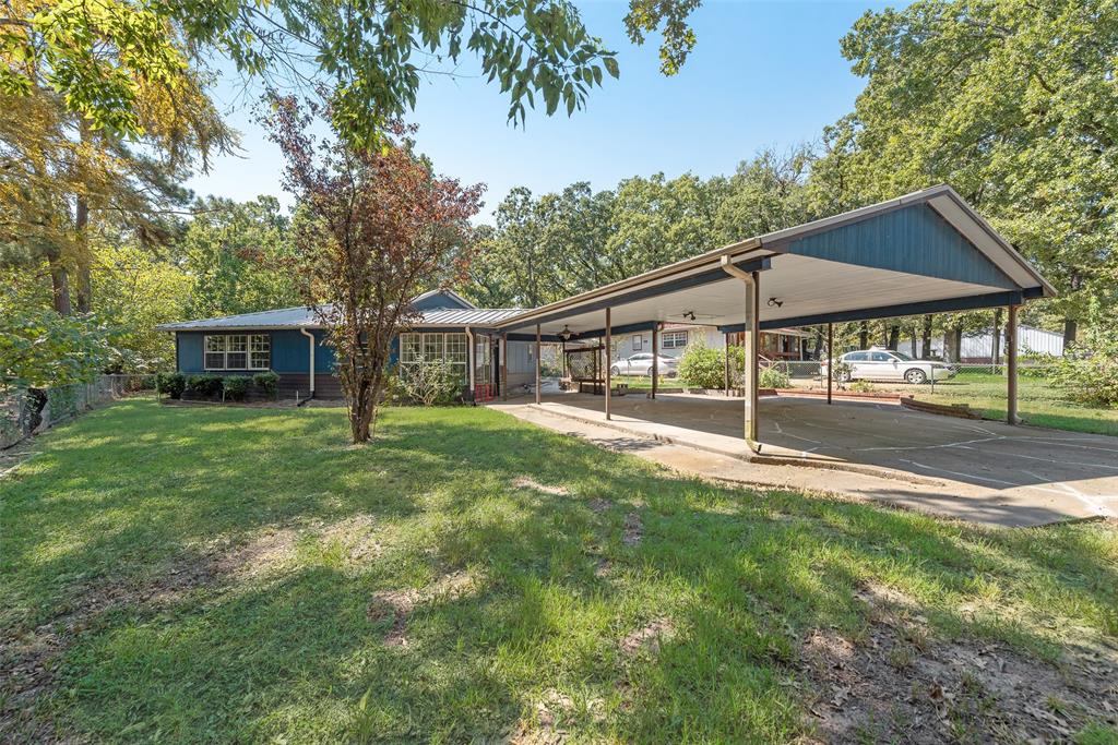 TREE LINED NEIGHBORHOOD...TRANQUIL LIVING NEAR THE WATER - YOUR CEDAR CREEK LAKE ESCAPE AWAITS - YOU CAN MAKE IT YOUR HOMESTEAD OR GETAWAY PLACE.   SELLER IS OFFERING CREDIT FOR NEW APPLIANCES AND 1-YEAR HOME WARRANTY TO THE BUYERS.  Tucked just moments from the shimmering shores of Cedar Creek Lake, this charming and spacious home offers the perfect blend of peaceful retreat and everyday convenience. Whether you're searching for a permanent homestead or a breezy weekend and summer getaway from the Dallas–Fort Worth metroplex, this property welcomes you with open arms and endless potential.
Step inside and immediately feel the warmth of an open floor plan designed for both relaxation and connection. Sunlight pours through large windows, bathing every corner of the home in natural light and creating an airy, uplifting atmosphere. A flexible bonus room provides the perfect space for a home office or creative studio — tailored to fit your lifestyle.
Outside, the home is nestled on a generous, fenced lot ideal for pets, play, and gardening. Cultivate your own herbs and flowers in the garden-ready spaces, or simply unwind under the shade trees while enjoying the tranquil sounds of nature. A sturdy shed offers additional storage for tools and lake toys, while the two-car carport keeps your vehicles protected and close at hand.
Just a short stroll away, the lake beckons with its community boat ramp and inviting greenbelt — a paradise for fishing, boating, and sunset strolls. When it's time to run errands or grab a bite, all the conveniences of W. Main Street are just minutes away, making everyday living refreshingly simple.
Whether you're drawn to weekend boating adventures, summer barbecues under the stars, or peaceful mornings with coffee on the porch, this Gun Barrel City gem invites you to slow down, settle in, and savor the best of Lake Life.