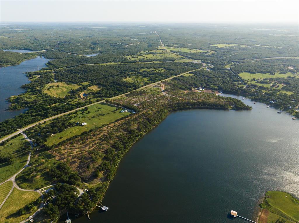 Tucked away in a cove, Lot 17 aka Oak Cove N. is quiet and private. Gentle slopes lead to easy lake access and calm, peaceful waters.

Located on Lake Amon Carter near Bowie Texas, Carter Heights is a lakefront community offering a limited number of build-to-suit lots. All properties offer either dock-able direct property lake access or convenient access to public dock facilities. Enjoy a serene setting with small-town feel near a golf club – an ideal place to build the lake home you’ve always dreamed of owning. Whether this is your getaway or your year-round home, you’ll love living the lake life in Carter Heights. WATER AND ELECTRICITY AVAILABLE!!