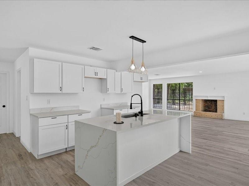 Come check out this beautifully remodeled 4-bedroom, 3 full bathroom home with a modern open floor plan and stylish updates throughout. The spacious kitchen features a large island perfect for cooking and entertaining. Major upgrades include a new roof, all new plumbing, new HVAC system, brand-new tankless water heater,  Enjoy a large backyard with gated rear access and extra parking in the back. Conveniently located near schools, shopping, dining, major highways, and just minutes from Downtown Dallas. Move-in ready and a must-see!