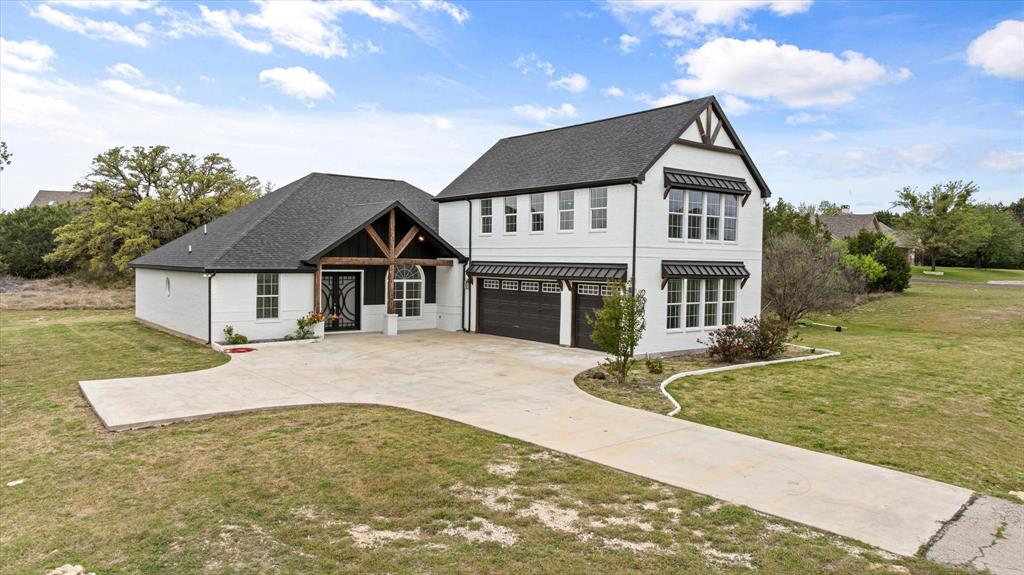 Welcome to this stunning modern farmhouse situated on a spacious homesite, offering the perfect blend of timeless charm and contemporary design. This beautifully crafted home features striking white brick exterior, bold black accents, and inviting wood beam details that create exceptional curb appeal.
Step inside to discover an open-concept layout designed for both everyday living and entertaining. The home offers a seamless flow between the living, dining, and kitchen areas, complemented by abundant natural light and thoughtfully designed finishes throughout.
The spacious primary suite provides a private retreat, while additional bedrooms offer flexibility for family, guests, or a home office. A large attached garage and extended driveway provide ample parking and functionality.
Enjoy peaceful outdoor living with plenty of room for entertainment, or simply take in the surrounding Texas landscape. Whether you’re looking for quiet country-style living or a stylish place to host, this property delivers.
Conveniently located with easy access to nearby amenities while still offering privacy and space—this is modern farmhouse living at its best