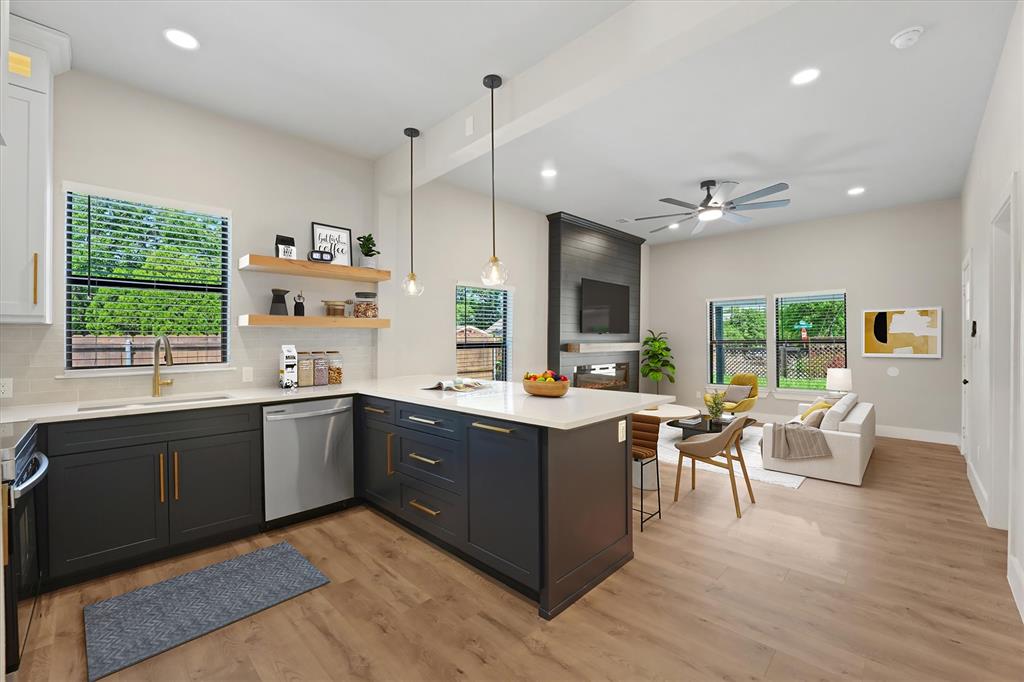 Unbeatable location! Situated within one mile of Bishop Arts District, the highly anticipated Halperin Park, and Lake Cliff Park, this completely remodeled, move-in ready home offers quick access to Trinity Groves, Downtown Dallas, and major highways including I-35E and I-30. Situated on a prime corner lot in the heart of Dallas, this 3-bedroom, 2-bathroom property features all-new electrical, HVAC, plumbing, roof, and more. Step inside to an open-concept layout designed for seamless living and entertaining. A sleek electric fireplace set within a custom accent wall creates an inviting focal point the moment you walk in. The kitchen is equally impressive, showcasing stainless steel appliances, stunning white quartz countertops, ceiling-height cabinetry, and a spacious island that flows effortlessly into the main living area. Additional highlights include a climate-controlled attic ideal for storage or flex use, an attached carport, and ample parking space for 5+ vehicles. Electric gates on both sides of the property provide added privacy and convenience, while an outdoor half bathroom enhances functionality for gatherings. Enjoy the outdoors from the large covered front patio, complete with dual ceiling fans. Combining modern upgrades with an unbeatable location near some of Dallas’ most sought-after destinations, this home delivers the perfect balance of comfort, style, and accessibility. Some photos are virtually staged to help you envision the possibilities this beautiful space has to offer.