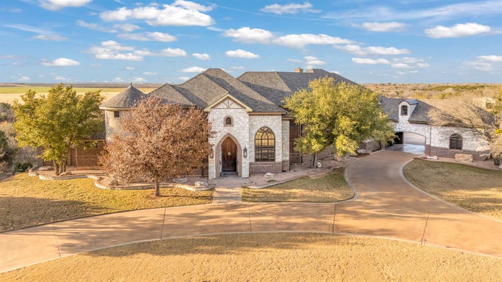 A rare opportunity to own a truly exceptional estate in Wylie West ISD, perfectly situated on 3.5 private acres. This stunning 7,800-square-foot residence offers an unmatched blend of luxury, functionality, and timeless design.Featuring 5 spacious bedrooms and 6 beautifully appointed bathrooms, the home is designed for both grand entertaining and everyday comfort. Multiple gathering spaces abound with 4 living areas, 2 dining rooms, a private office, and a media room, providing flexibility for every lifestyle need.The primary suite is a true retreat, complete with a cozy fireplace, spa-like bath, and expansive walk-in closet. Two additional living areas also feature gas fireplaces, adding warmth and elegance throughout the home.At the heart of the estate is a chef’s dream kitchen, showcasing commercial-grade gas range, warming drawer, icemaker, and premium finishes—complemented by a fully equipped butler’s kitchen with top-of-the-line Wolf appliances, ideal for entertaining on any scale.
Additional highlights include a safe room, four garage spaces, a porte-cochère, and a gated electric entry for enhanced security and privacy.
Step outside to your own resort-style oasis featuring a beautiful pool and outdoor fireplace, perfect for relaxing or hosting unforgettable gatherings under the Texas sky.This extraordinary property delivers luxury, space, and privacy—an estate-level home rarely found in Wylie West ISD.

Buyer and Buyers agent to verify materials, square footage and schools.