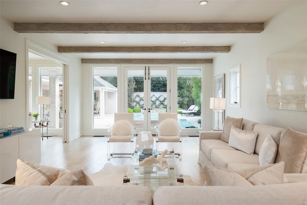 Welcome to a captivating blend of classic French charm and modern sophistication in the heart of Highland Park. This transitional home boasting 4 beds and 5 baths is nestled in the enchanting French streets within walking distance to Highland Park Village, Dallas Country Club, and Bradfield Elementary. The home has been meticulously updated and reimagined under the design directive of William S. Briggs Architect. Timeless marble selections and hardwood flooring create an atmosphere of refined elegance and enduring beauty. First floor includes gracious foyer flanked by formals, large family room open to a stunning kitchen and breakfast area, cozy den with beamed ceiling affords picture perfect views of outdoor living spaces and serene pool with fountains. Second floor is home to the primary suite with expansive bath, 3 ensuite bedrooms, study, and laundry room. Rounding out this property is a 2 car detached garage adorned with gas lanterns and a motorized iron gate for added privacy.