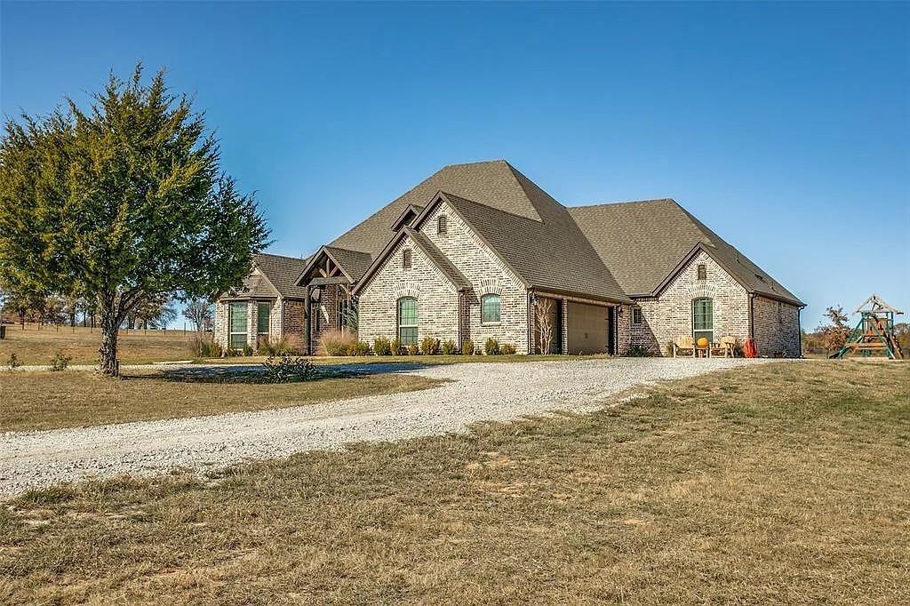 Nestled on 6.5 acres in Decatur, TX, this stunning 3419 sf residence offers 4 bedrooms and 3.5 baths.  The main house features  spacious living areas, with modern finishes and ample natural light.  Step outside to a sparkling pool with attached hot tub, perfect for relaxation and entertaining against a backdrop of expansive greenery.  A 30x40 shop with a one bedroom apartment overlooking the pool complements the property with endless possibilities.  The land is fully fenced for horses or cows.  The land is AG-EXEMPT.  Its ready for a family and livestock.  Its only 6 minutes to the city of Decatur.