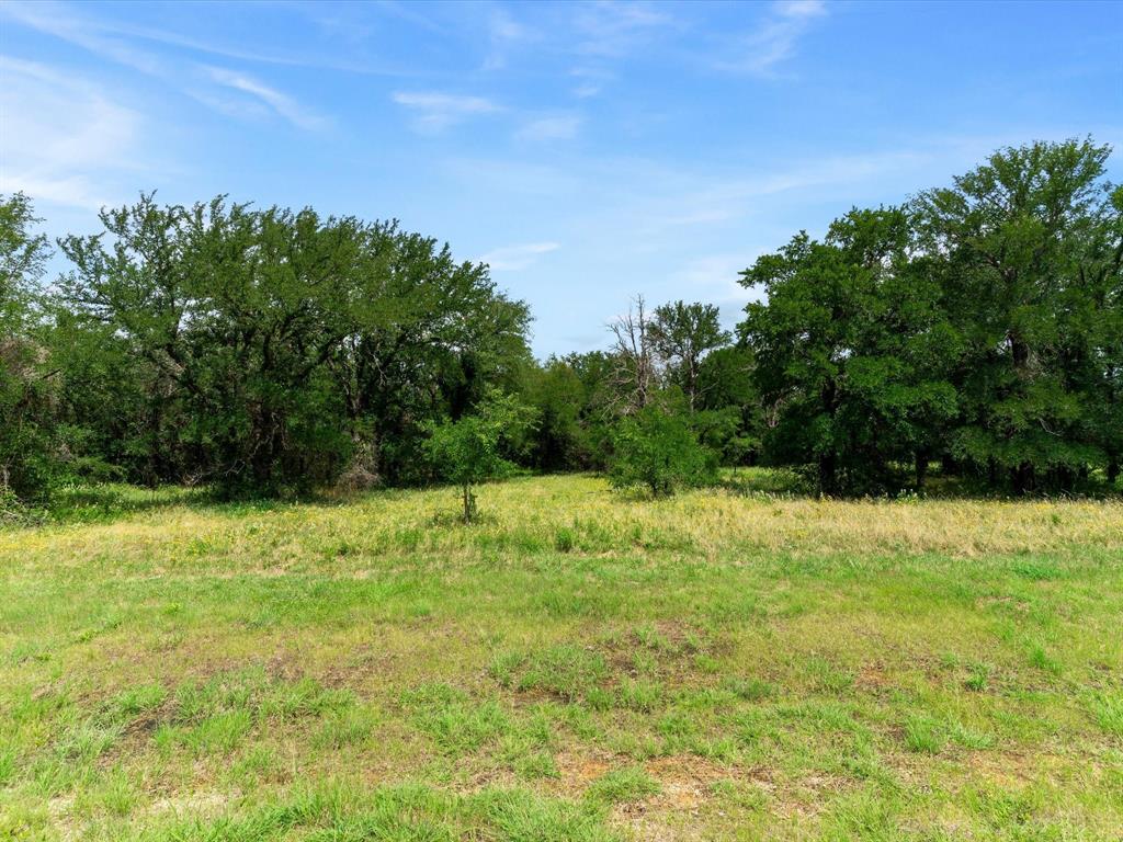 Rare opportunity to own 11 heavily treed acres in the desirable Lola Creek Ranch community in Boyd, TX. This beautiful corner tract offers privacy, mature trees, and multiple potential build sites for your dream home. Enjoy the peace of country living while remaining conveniently located near Boyd, Springtown, Azle, and Fort Worth. Bring your own builder or explore a fully customized home with Doug Parr Homes. Plenty of room for a workshop, barn, pool, or additional outbuildings Whether you're looking to build a private estate, weekend retreat, or forever home, this property offers the space, flexibility, and natural beauty to make your vision a reality.