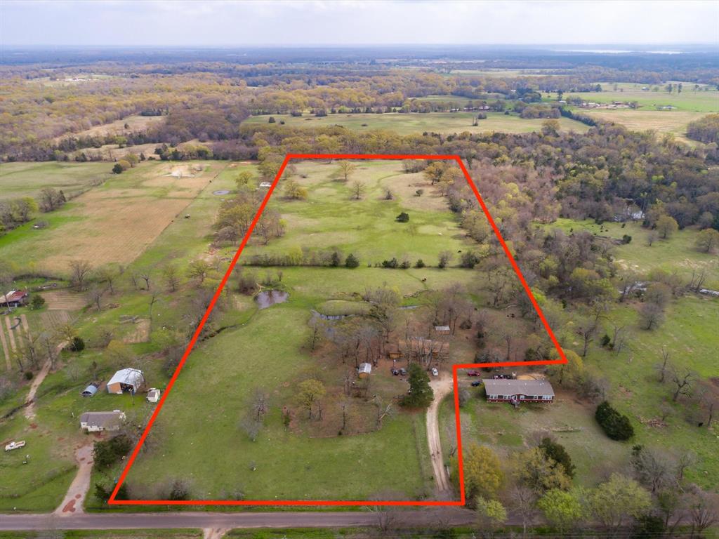 Endless possibilities await on this beautiful 18-acre ag-exempt property just minutes from Lake Fork! Located outside the city limits, this property features a mix of open pasture and mature trees, making it ideal for building your dream home, starting a small ranch, subdivide to smaller lots, or enjoy a peaceful weekend retreat.
The property includes a 3 bedroom, 2 bath manufactured home that is not livable and is being sold As-Is. Seller is offering up to $10,000 in concessions toward its removal. Water, electricity, and septic are already in place (buyer to verify), along with two large shops with electricity that provide plenty of space for storage, equipment, or a workshop.
Bring your vision and make this East Texas property your own!