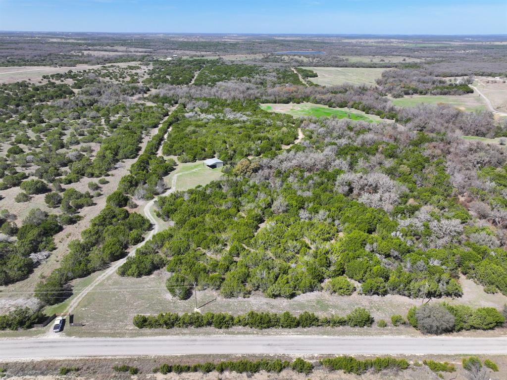 Hunters, Outdoors men and women, nature lovers, come see this undeveloped, unspoiled 78 acres in Erath County.  Currently with a wildlife exemption and filled with wildlife, the seller has spotted deer, wild hogs, and wild turkeys. This is where you go to get away from it all. There is a small camp house on the property with power (no water) a great place to stow your gear and spend the night if you are out roughing it for the weekend.  Seller will consider subdivide, in minimum 10 acres tracts, for someone hoping to build their dream house in the country. Exceptional location feels isolated and private but is just 17 minutes to shopping, dining, schools or medical in Stephenville. No City Taxes, No Restrictions, No HOA....Property is behind a locked gate, requires confirmed appointment to walk or drive on propery.