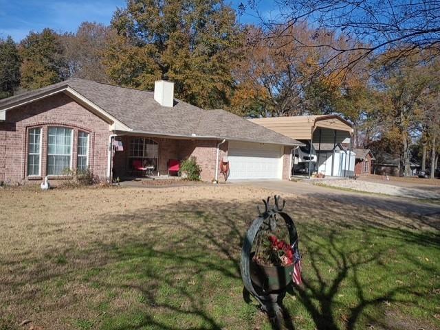 Beautiful home in a quiet neighborhood, Open floor plan, pan ceilings, with ceilings fans throughout the home. Cozy Fireplace in the Livingroom for the cool winter nights, screened in back porch for enjoying the evenings in the Spring, a well-designed kitchen with lots of extra touches for cooking those family meals. 3 spacious bedrooms with walk-in closets, sitting area in the primary bedroom, full size shower in the bath, plus plenty of cabinet space. Two additional bedrooms and full bath on the opposite end of the house plus a 2-car attached garage with heat and ac. Outside there is so much more, large, insulated shop building with, two overhead doors with openers, walk through side door and room for your cars, truck, boat, plus a workshop with room for tools or hobbies. And for those who have an RV, the RV Port with full hook-ups make being ready for travel a snap. Private well furnishes water for the time activated yard sprinkler system. Just minutes from Mineola, Lake Fork, schools, shopping and so much more. You need to see this to really appreciate it. Call and set up your viewing.