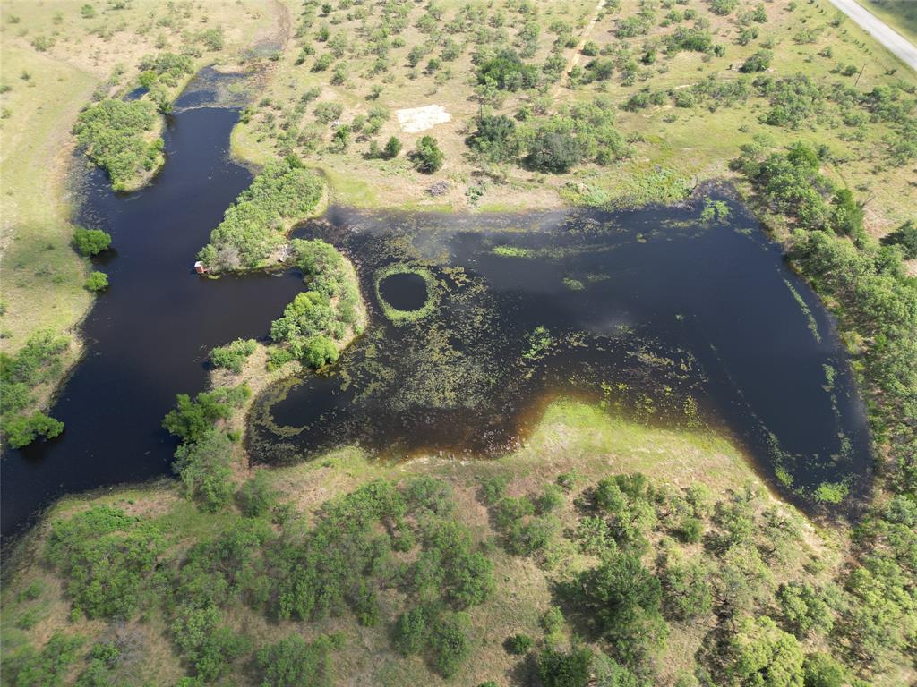 This property boasts four tanks, beautiful bull mesquite flats, oak trees, and the Herd Branch Creek, sourced from the pecan bayou. With fenced and cross-fenced boundaries, this land offers security and convenience. It showcases nearly two miles of road frontage, divided between Highway 283 and FM 2926. Hunting opportunities include whitetail deer, feral hogs, Rio Grande turkey, dove, and even bob white quail can be spotted here. A barn, shed, and a set of cattle pens are already in place, providing convenience for potential buyers. Whether you are considering farming, ranching, or enjoying the great outdoors, this land offers endless possibilities. This property is priced at $3,850 per acre.