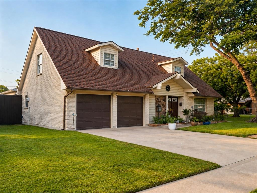 Property sits on a landscaped corner lot featuring a mature shade tree, a two-car garage, and a concrete driveway. The main home interior includes hardwood-style flooring and updated lighting. The primary suite features a remodeled bathroom equipped with a double vanity, quartz countertops, white subway tile, and a walk-in shower with a rainfall showerhead. The backyard is enclosed by a privacy fence with a gated side yard, and features artificial turf and a flagstone patio. The property includes a fully detached, 500-square-foot accessory dwelling unit (ADU) in the backyard. This detached structure features an independent entrance, a high-efficiency mini-split HVAC system, a shiplap entryway, an open-concept living area, a dedicated loft space with built-in shelving, and private bathroom facilities. Located near shopping, dining, and major thoroughfares.