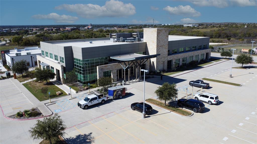 200 Bailey Ranch Road, a premier 46,912 SF Class-A office building situated on 3.31 acres in Aledo, Texas. Parker County, city of Aledo is one of the fastest-growing submarkets in the DFW metro area. This turn-key, high-quality property offers five conference rooms, three training rooms, two community kitchens (one full), multiple break rooms, a systems operations room and command center, covered outdoor areas, and an on-site backup generator. Originally built for a medical user, the flexible design easily adapts to medical, professional office, or corporate headquarters use. Offered below replacement cost, 200 Bailey Ranch Road delivers exceptional value with premium finishes, advanced technology infrastructure, and immediate occupancy potential. With strong area and traffic count demographics; limited Class-A office supply, and strategic access to major DFW corridors this property represents a rare opportunity.