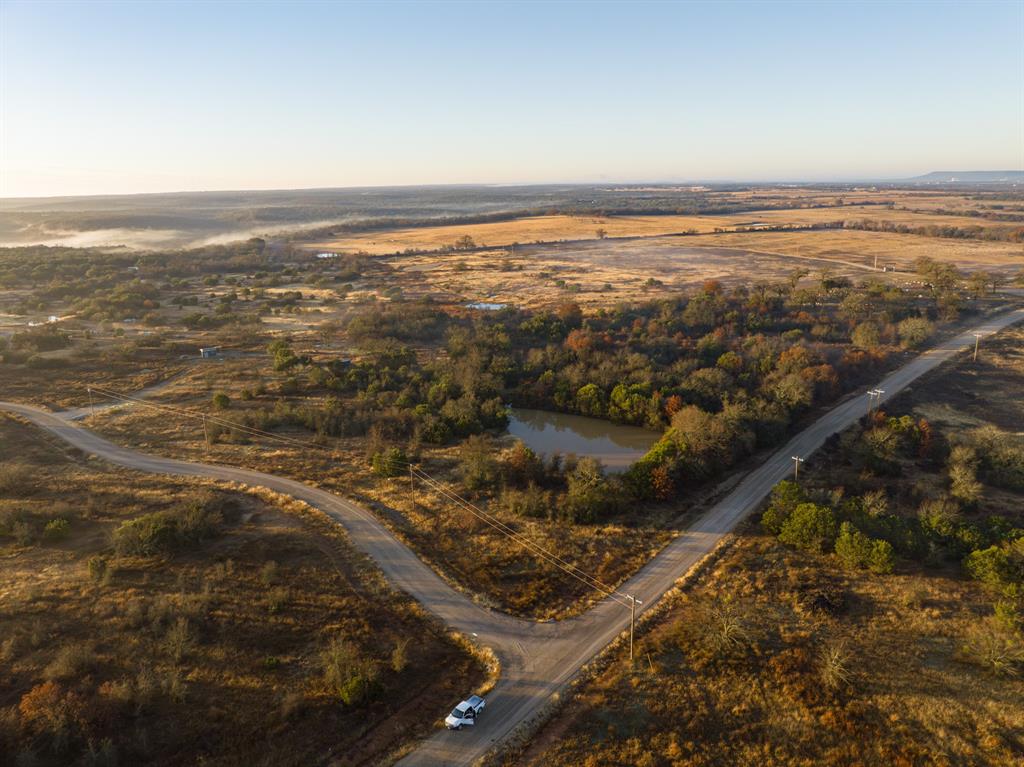 Escape from the City and own your own Ranch inside a private gated Community at River Bend Ranch. Low property taxes with the AG Exemption Status on all lots via the Cattle Grazing Association. Paved roads, as well as power on site. 360 degree views of the Palo Pinto Mountains. Build your dream home or start your own short-term rental staycation. Assess to a 5 acre community lot for additional lake access to the Brazos River. Come see this lot for yourself and schedule a showing!