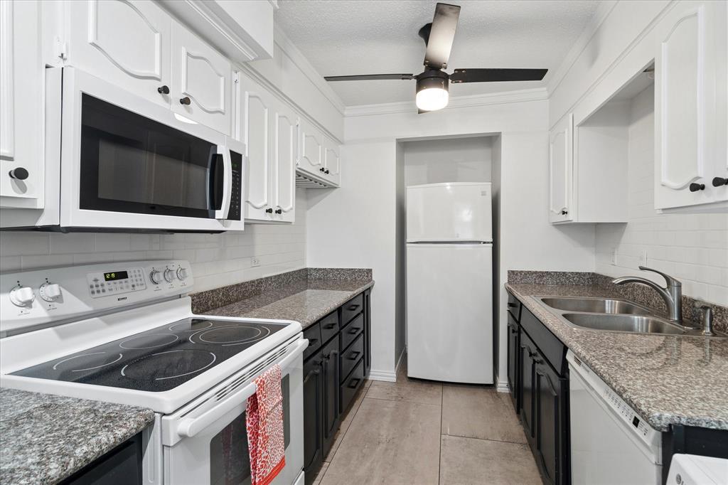 Wonderful 2 bedroom, 2 bath condo offering comfortable living space in the heart of Dallas. The living room, dining room and bedrooms feature beautiful hardwood floors with a herring bone design. The efficient kitchen offers granite counter tops, tile floors, all the necessary appliances and utility hook-ups for a full size washer & dryer. The open-concept living and dining area, with a wood burning fireplace, opens to the outdoor, covered patio, that overlooks the pool, and is perfect for entertaining. An abundance of natural light enters the home through the dining room's floor to ceiling glass windows, equipped with plantation shutters. The primary suite offers ample closet space, an ensuite bath and your choice of a sitting area, make-up area or office area. Both bathrooms feature italian tile floors. Condo has ample storage and stylish light fixtures. Enjoy the convenience of low-maintenance living with access to a sparkling community pool, just steps from your front door, on-site laundry facilities, and an assigned covered parking spot in the gated area. The HOA also covers exterior maintenance, water, trash, and most utilities — making this an ideal opportunity for effortless urban living. For those who want effortless living, a true lock-and-leave lifestyle, this home provides unmatched convenience to freeways, shopping, dining, entertainment and schools. If you're an outdoor enthusiast, Northaven Trail is just steps away. If you're looking to downsize, travel freely, or enjoy a streamlined lifestyle, come tour this condo!