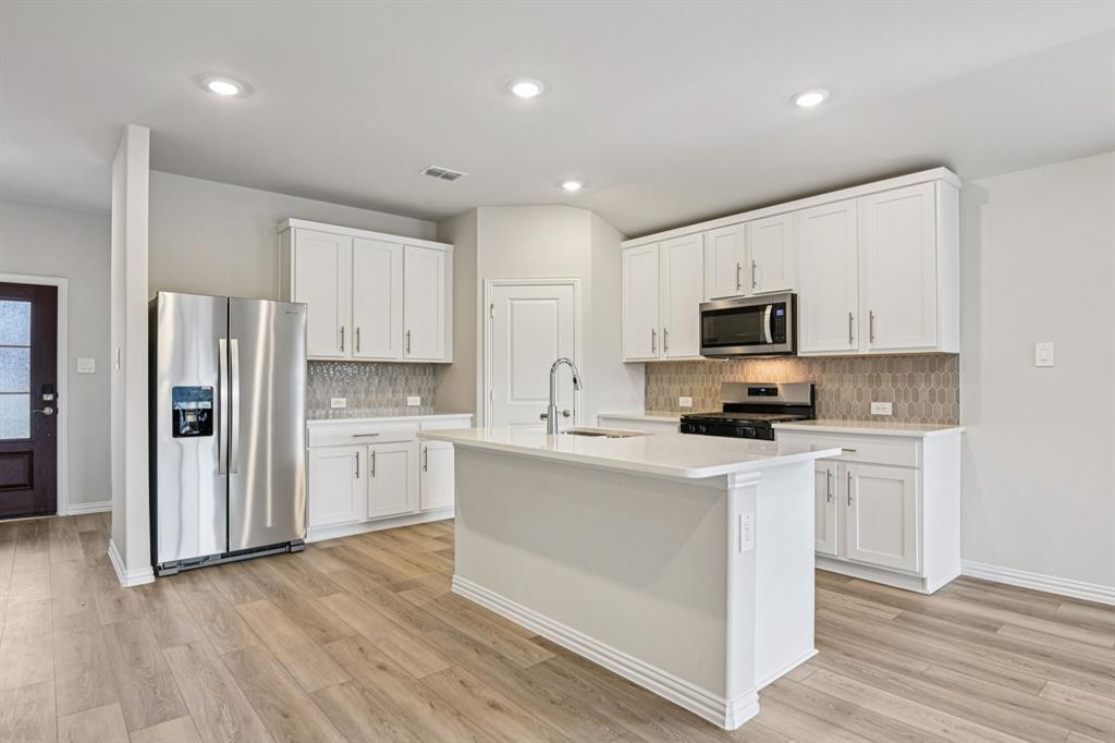 BRAND NEW energy - efficient home Sep 2026! A private study in the Oleander makes a perfect home office or play room. Pebble cabinets with marble-look white granite countertops, beige tone EVP flooring and multi-tone grey carpet. New energy-efficient move-in ready homes in Dallas-Fort Worth include a washer, dryer, fridge, and whole home blinds, plus they can be closing-ready in 60 days or less–guaranteed. Have it all: Relax in your private primary suite, enjoy the covered back patio, and our open concept floorplans, all with easy access to Fort Worth, Arlington, and Grapevine.