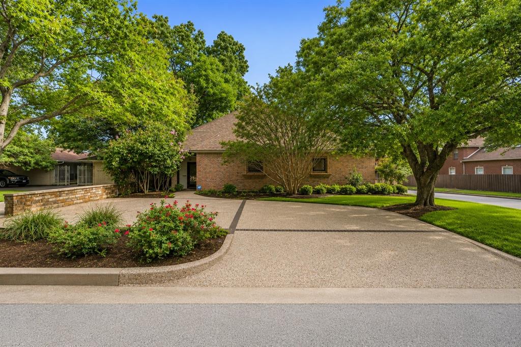 Nestled in the highly sought-after Country Club Heights neighborhood, in the heart of the prestigious Monticello and Rivercrest area, this spacious 3-bedroom, 4-bath residence offers 3,696 square feet of timeless architecture, exceptional storage, and versatile living spaces. Step inside to soaring ceilings, rich hardwood floors, custom built-ins, and an impressive living room anchored by a fireplace and walls of windows that fill the home with natural light. Designed for both everyday living and entertaining, the home offers multiple gathering spaces, including a formal dining room, wet bar, and a sunroom that is perfect for a home office, workout room or library. The oversized primary suite is a rare find, featuring separate his-and-her bathrooms and walk-in closets, creating a truly private retreat. Upstairs, you'll find a generous second living room - playroom along with two oversized bedrooms, each complete with its own en-suite bath and walk-in closet. The kitchen offers abundant cabinetry, double ovens, a gas cooktop, custom refrigerator, and ample prep space for the home chef. Storage is abundant throughout the home, including extensive built-ins and an enclosed attic space ideal for seasonal storage. Outside, enjoy a private courtyard-style setting and a pergola-covered deck, outdoor grilling area, and beautifully landscaped patio spaces designed for relaxing or entertaining guests. Located in one of Fort Worth's most desirable neighborhoods, this home offers easy access to Rivercrest Country Club, downtown Fort Worth, the Cultural District, and some of the city's finest dining and shopping.