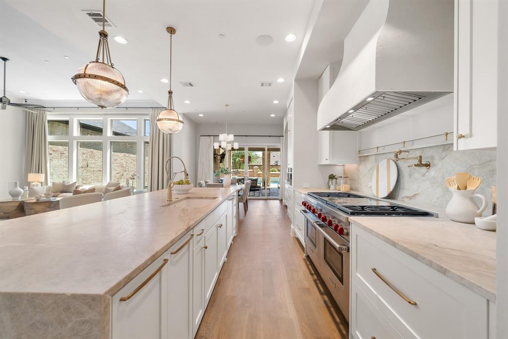 Located within the prestigious, guard-gated community of Newman Village, this exceptional residence seamlessly blends beautiful, timeless design with modern comfort and effortless livability. From the moment of entry, the home exudes warmth and intention, with a thoughtfully balanced layout enhanced by its desirable northeast-facing orientation—filling the interiors with soft, natural light throughout the day.
Designed for both refined everyday living and grand-scale entertaining, the home features a private theater, expansive game room, and two dedicated office spaces—ideal for today’s dynamic lifestyle. At the heart of the home, the chef’s kitchen showcases premium appliances, an oversized walk-in pantry, and a bright breakfast area that flows seamlessly into the main living spaces.
Step outside to a true backyard retreat—complete with an Artesian-built pool and spa, putting green, outdoor fireplace, and a fully equipped kitchen featuring multi-fuel grilling, pizza oven, beverage stations, and optional Phantom screens for year-round enjoyment.
The second-floor primary suite offers a private sanctuary, uniquely appointed with its own staircase leading directly to the outdoor living area. A secondary primary suite on the first floor provides exceptional flexibility for multigenerational living or hosting VIP guests.
Additional highlights include dual utility rooms, a 4-car garage, and a fully integrated IT command center with whole-home audio and pre-wired surveillance. Recent upgrades—including a new roof (2026), newly installed flooring, and fresh interior paint—ensure a truly move-in ready experience.
Ideally located just minutes from Dallas North Tollway, PGA Frisco, The Star, Universal Kids Resort, and Legacy West.
A rare opportunity to own a meticulously designed luxury home in one of Frisco’s most sought-after communities—where lifestyle, comfort, and sophistication converge.
Motivated Seller.