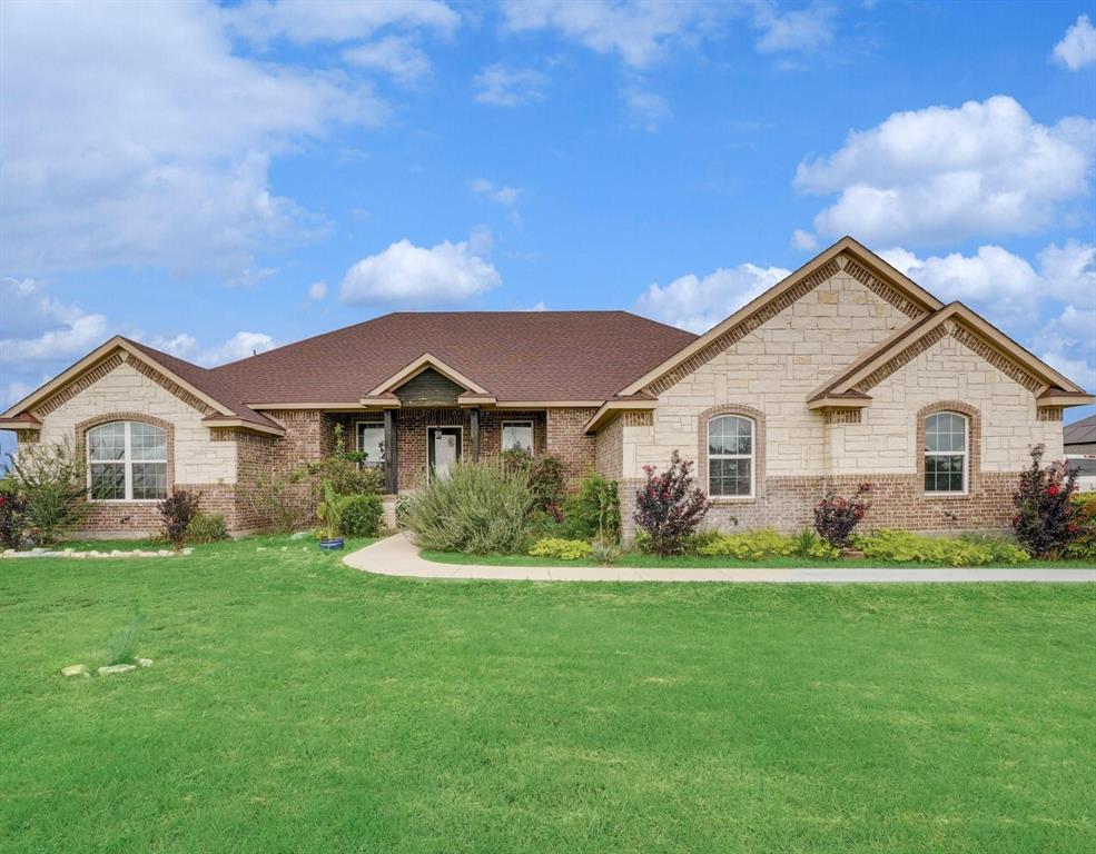Stunning 4-bedroom home nestled on nearly half an acre, offering space, comfort, and privacy. Step inside to a bright, welcoming living area featuring soaring ceilings, rich bamboo flooring, and a striking stone fireplace that anchors the space. The chef-inspired kitchen is designed to impress with stainless steel cooktop and oven, granite countertops, an oversized breakfast bar, decorative lighting, a massive walk-in pantry, and abundant cabinetry for storage.

The thoughtfully designed split floor plan offers three generously sized secondary bedrooms—each with walk-in closets—including one with a private ensuite bath. Tucked away for privacy, the expansive primary suite serves as a true retreat with dual vanities, a separate shower, a relaxing garden tub, and two spacious walk-in closets.

Unwind in the peaceful backyard beneath the covered patio, surrounded by garden views and open skies—perfect for quiet evenings or entertaining. Located outside city limits, this home delivers the charm of country living with modern conveniences and the freedom of NO HOA.

Complimentary 3-2-1 Buydown Available.
1 Year - 3.625 % (Payment: $ 2,062)
2 Year - 4.625 % (Payment: $ 2,325)
3 Year - 5.625 % (Payment: $ 2,603)
4-30 YR - 6.625 % (Payment: $ 2,895)