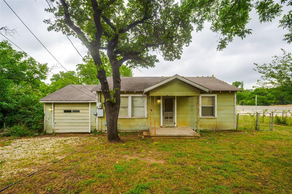 Near UNT campus and I-35 investment grade property with solid bones has a great re-do potential for rental, flip  OR tear down!  Value here is in the land!! DOUBLE LOT on corner over quarter acre!  This home needs a complete redo, so the inside looks like you are walking back in time! See attached plans that were done to convert this home into a cozy 3-2 (by enclosing garage) with added front and back porches!  This home is NOT A WHOLESALE deal it is privately owned!  Being sold AS-IS, WHERE IS, no repairs to be made.  *Please no blind offers or wholesalers!