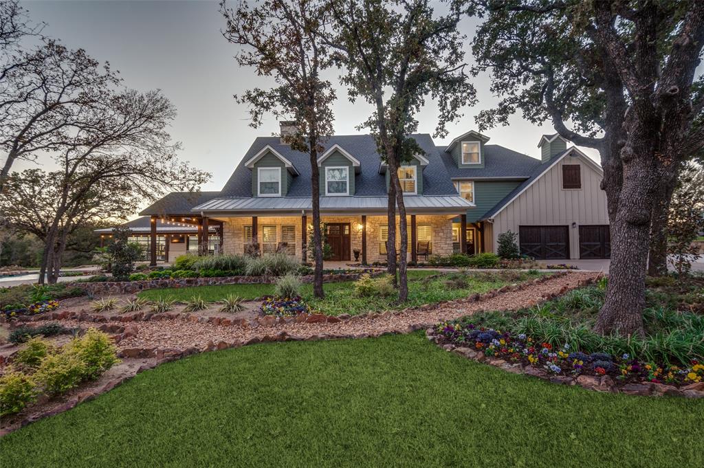 Contemporary farmhouse on 5.06 treed acres overlooks mature trees and a tranquil pond with private dock.  New pool, pool house, landscaping and hardscaping in 2024. The heated & cooled pool has a waterfall, bridge, spa and fire pit.  Main house 4,411 SqFt has 4BR, 4BA, hand scraped hardwoods, amazing chef’s kitchen with massive center island, double refrigerator, double Bosch dishwashers and 11x11 walk-in pantry with beverage station.  Accessory dwelling unit is 1,575 SqFt with galley kitchen, twin mounted TV’s above a breakfast bar and a full bath. Climate controlled garage has electric charging station and workout space with mounted TV, double refrigerator and ice machine.  Separate workshop is climate controlled, with RV parking, 50amp outlets and an office.  Control4 home automation system (OS) integrates all technology in home, pool, pool house and workshop and is touch pad or smart phone programmable. Generac 48kW backup generator provides backup power to all buildings.
