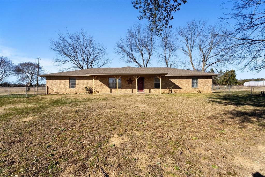 Situated in the peaceful countryside, this well-maintained 3-bedroom, 2-bath home offers 1,690 square feet of comfortable living on an acre. Recent updates include newly installed flooring, a new stove, and refrigerator, while a new aerobic septic system installed in Spring 2025 provides added peace of mind. The spacious yard offers plenty of room to enjoy the outdoors, and a concrete pad in the backyard marks the site of a former shop - ready for a workshop, greenhouse, or outdoor entertaining area. A well-maintained oil-top road leads you in, giving you privacy without sacrificing convenience to town. Move-in ready and conveniently located just minutes from town, this property is the perfect blend of rural charm and everyday convenience. Schedule your showing today!