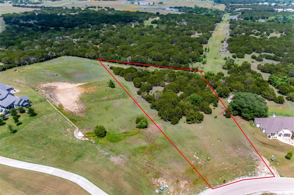 NEW PRICE!!!  Incredible opportunity to build your dream home on 2.3 acres in the sought after gated community of Rolling Creek Ranch in Granbury, TX.  This beautiful perimeter lot is located on the bend of Heathington Ct.  Rolling Creek Ranch is a newer community on the Fort Worth side of Granbury with Acton feeder schools.  Lush mature trees with the perfect build site.  Schedule your tour today.