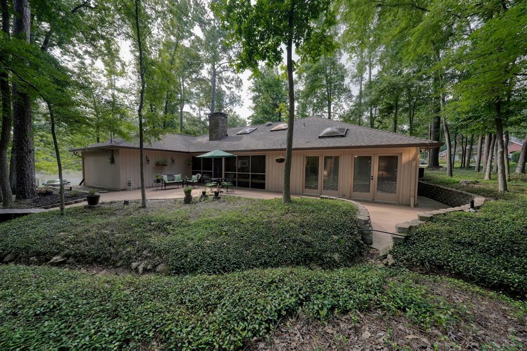Welcome to your serene retreat in the beautiful, gated community of Hideaway! This charming 3 bedroom, 2 bath home offers 2,148 square feet of well designed living space, perfectly blending comfort, functionality, and timeless elegance. From the moment you step inside, you're greeted by an inviting open concept layout that’s ideal for both everyday living and entertaining. The spacious living area features a cozy fireplace, abundant natural light, and seamless flow into the dining area and kitchen.

The kitchen is a true standout, offering ample counter space, a breakfast bar, and generous cabinetry for all your storage needs. Whether you're whipping up a quick meal or preparing a feast, this kitchen is sure to impress.

The primary suite is a private retreat with plenty of room to relax and unwind. It includes an ensuite bathroom with dual sinks, huge walk in shower, and a large walk in closet. The two additional bedrooms are nicely sized and share a full guest bath, making this home ideal for families, guests, or a home office setup.

One of the highlights of this property is the screened in porch perfect for enjoying morning coffee or relaxing evenings without the bother of bugs. Step outside and take in the peaceful views of the low-maintenance, wooded corner lot, offering both privacy and natural beauty year-round.

Located within the highly desirable Hideaway Lake community, residents enjoy access to 24 7 security, three sparkling lakes for fishing and boating, a 27-hole golf course, community pool, parks, walking trails, clubhouse, and more. With convenient proximity to Lindale’s shopping, dining, and award-winning schools, this home offers a perfect blend of tranquility and accessibility.

Don’t miss this rare opportunity to own a home in one of East Texas’s most sought-after communities—schedule your private tour today and discover all that this exceptional property and lifestyle have to offer!