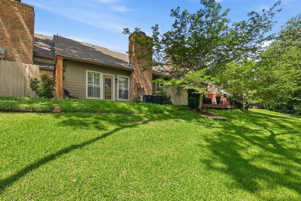 Hidden among towering mature trees and backing to a tranquil greenbelt and creek, this beautifully renovated residence offers a rare opportunity to experience a private, nature-inspired retreat in the heart of Dallas. Located within a highly sought-after community in Lake Highlands, that blends sophisticated updates with an effortless lock-and-leave lifestyle. From the moment you step inside, the home feels warm, elevated, and serene, designed for buyers who value both comfort and convenience. The expansive living room is anchored by a striking fireplace and framed by peaceful greenbelt views, creating an atmosphere that feels more like a luxury retreat than a typical townhome. Large windows invite natural light throughout while connecting the indoor and outdoor living spaces. The remodeled kitchen features timeless finishes, a newer range and refrigerator, brand-new dishwasher (2026), and updated fixtures throughout. Additional improvements, including two brand-new HVAC systems (2026), updated bathrooms, designer lighting, ceiling fans, and new carpeting, offer true turnkey living and peace of mind. One of the home’s most desirable features is its dual primary suite layout, ideal for modern living. Both bedrooms are generously sized with ensuite baths, while the upstairs owner’s retreat offers an additional flex space perfect for a private office or fitness area. Step outside to your private patio and unwind to calming creek views and extraordinary privacy rarely found in townhome living. Residents enjoy beautifully maintained grounds, a resort-style community pool, walking areas, and HOA-maintained landscaping and roof care for a truly low-maintenance lifestyle. Ideally positioned near White Rock Lake, premier shopping and dining in Lake Highlands, and major commuter routes including 635 and US-75, the home also benefits from highly acclaimed Richardson ISD. Elegant, turnkey, and surrounded by nature, this home offers an exceptional lifestyle.