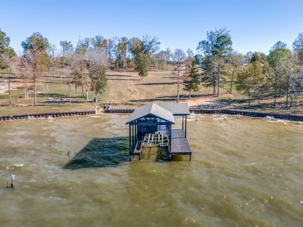 Build your dream lake home on this exceptional waterfront lot in the prestigious, gated community of Southshore at Lake Bob Sandlin. Spanning just under 1.5 acres, this cleared, construction-ready property offers underground utilities already in place along with a newly installed drainage basin featuring dual 24-inch pipes for enhanced water management.

Significant improvements have already been completed, including a brand-new retaining seawall and a fully functional boathouse with storage, situated on a newly constructed deck completed in November 2024. This property is truly ready for immediate development without the added upfront site costs.

The gently sloping terrain provides stunning sunset views over the water, ideal for a primary residence or weekend retreat. Conveniently located within a short drive of the DFW metroplex, with easy access to nearby shopping, dining, and recreational amenities.

A rare opportunity to own premium waterfront property in one of the area’s newest and most desirable lakefront communities.