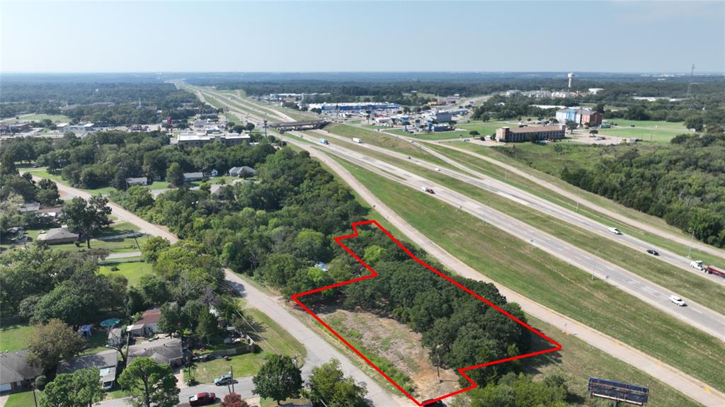 WHAT A GREAT SMALL ACREAGE OF 400 PLUS FEET OF HIGHWAY 75 ACCESS ROAD FRONTAGE ON THE NORTH SIDE OF FAST GROWING DENISON TX, ON THE EAST SIDE OF 75, JUST PAST THE MCDONALDS, BRAUMS AND BEST WESTERN.  1.14 ACRE TRACT IS ZONED COMMERCIAL.  IF YOU ARE LOOKING FOR A SMALL TRACT OF LAND WITH HIGHWAY FRONTAGE FOR YOUR NEXT BUILD, BE SURE TO TAKE A LOOK AT THIS 1.23 ACRE TRACT.  LESS THAN A QUARTER MILE TO RETAIL, DINING, MEDICAL, NEW QUIK TRIP, WHATABURGER, MCDONALDS, CHIC FILET PLUS MUCH MUCH MORE AND ALL WITHIN THAT QUARTER MILE.  NEW SURVEY IN DOCUMENTS. 
ACCURATE LEGAL IS TWO PARCLES, POINT LOOKOUT ESTATE, BLOCK 2, LOT 35 & PT 34, AND ABANDONED STREET ROW PT ALLEY, ACRES 1.14 AND WITTENS ADDN, BLOCK 2, LOT PT 15, ACRES .0883