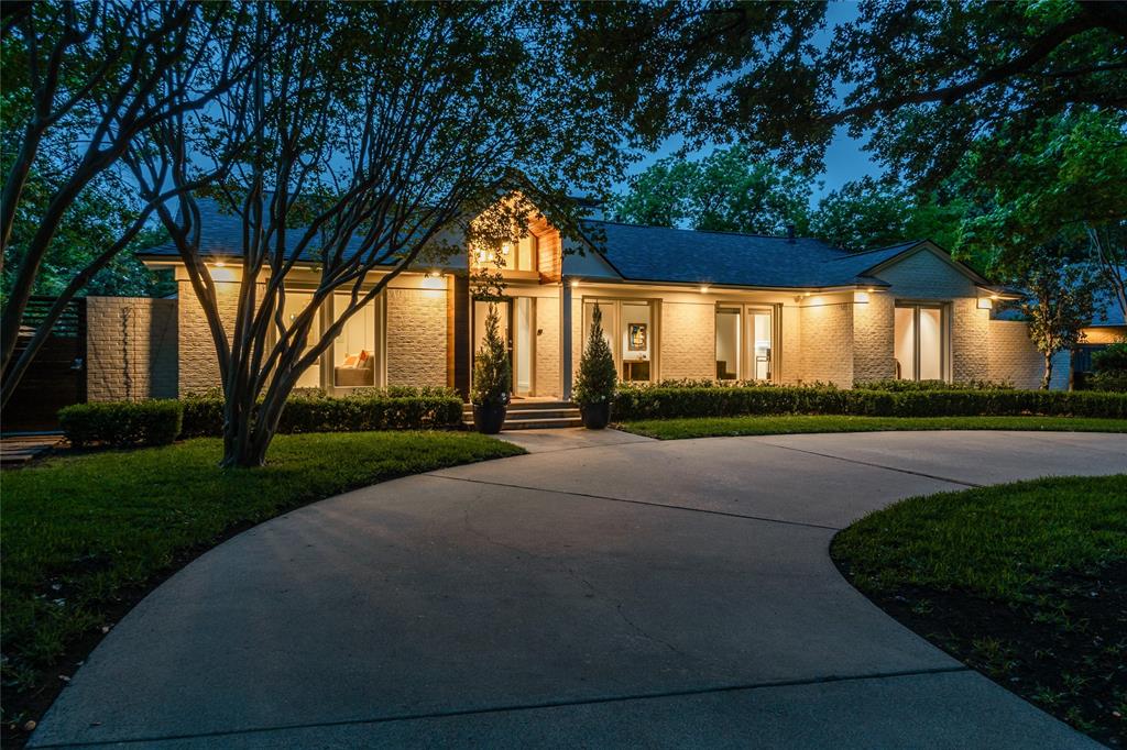 **A MUST SEE**  Striking single-story contemporary home with exceptional curb appeal, set on an oversized, beautifully landscaped lot shaded by mature oak trees and enhanced by a circular drive. Ideally located just a short 10–12 minute walk to Highland Park Village’s premier shopping and dining. Extensively updated with refined design finishes and major system improvements, the interiors are defined by expansive windows, level 5 finish walls, hardwood flooring, and Lutron LED lighting. A thoughtfully designed open-concept floor plan connects multiple living areas each anchored by electric and gas starter fireplaces creating a seamless flow that is both sophisticated and highly livable, extending effortlessly into a dedicated dining space. The kitchen is both polished and functional, appointed with quartz and SS surfaces, Dacor and SubZero appliances, a large island with seating, and a breakfast bar ideal for casual dining and entertaining, along with an ice maker and walk-in pantry. The primary suite offers a private retreat with a fireplace, dual baths, custom walk-in closets, and direct access to the outdoor deck. Secondary en-suite bedrooms maintain the same level of finish, including a private deck-access suite and a well-positioned front suite ideal for guests, a nursery, or a home office. The backyard is designed for elevated outdoor living, featuring a covered redwood deck, a Harold Leidner-designed pool, newly installed turf (2026), and a separate fenced side yard. Recent capital improvements enhance both functionality and peace of mind, including a new roof (2025), updated HVAC systems with a new 5-ton unit (2026) and air purification upgrades (2024), and a new 50-gallon water heater (2026). Direct rear alley access to the garage offers additional parking and a level of convenience rarely found in the area.  **Don't let this one get away!!!