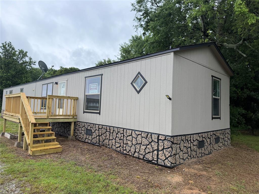 Whether you're looking for a weekend retreat, a homestead, or an investment, this 1.85 acres delivers endless possibilities. Move-in ready and thoughtfully planned, this home is a strong option for buyers seeking comfort, efficiency, and a well-balanced indoor-outdoor living experience. This 2024,  3 bedroom, 2 bath home features a split floor plan and an open, inviting layout that feels like new, with most kitchen appliances included for easy move-in.  The kitchen flows seamlessly into the dining and living areas--perfect for family gatherings or entertaining. The unique walk in pantry is like a hidden safe room. The master suite with its own bath.  Large laundry room. Wood look luxury vinyl flooring in main area of the home is easy upkeep.