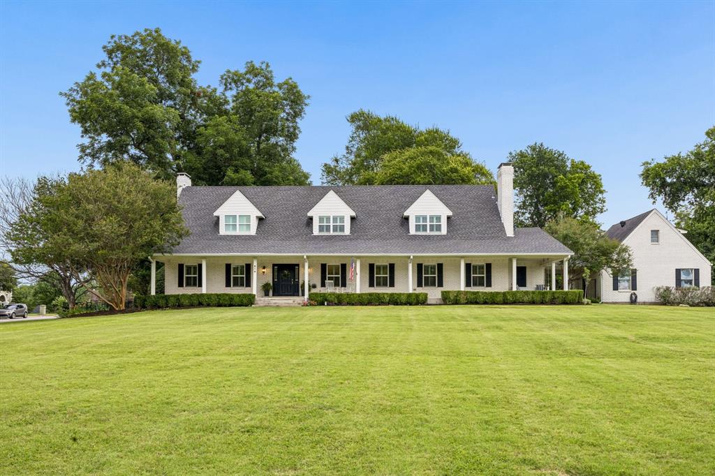 Sophisticated Living in the Heart of Heath!  Discover the perfect blend of elegance and comfort in this exquisite 3-bedroom, 3.1-bathroom residence nestled on a desirable corner lot.  The front covered porch extends the entire length of the home which is perfect for watching the sunsets.  Step inside to an inviting atmosphere complete with an abundance of character.  You'll be impressed by the expansive living areas, featuring stunning hardwood floors that gracefully flow through the majority of the home. The refined interior is punctuated by plantation shutters throughout the home to provide both style and functionality.  Each bathroom has been meticulously updated to reflect contemporary design trends while maintaining timeless appeal.  The heart of the home is an impressive living area and kitchen where gatherings easily flow from one room to the next.  Beamed ceilings, built-ins, custom period cabinets, a butcher block countertop, wine cooler, double oven, and additional storage solutions are thoughtfully integrated in the home.  The primary suite is a tranquil retreat featuring a luxurious ensuite bathroom with separate vanities, walk-in shower and garden tub.  An office is located on the first level and has an abundance of shelves and storage.  Outside, enjoy living on a landscaped acre with mature trees that offer endless possibilities for outdoor enjoyment. Perfect for hosting or unwinding, the large back patio with pavers and a fire pit in the yard provide a private oasis for dining, relaxing, or entertaining.  Other features include two tankless water heaters, vaulted ceilings, granite countertops, and gorgeous views of Lake Ray Hubbard.