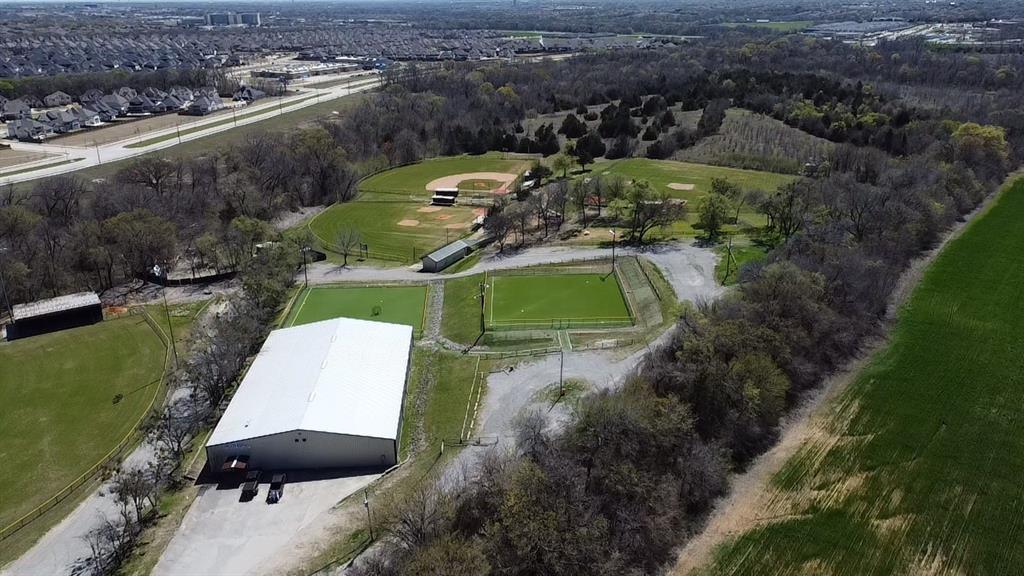 Nestled just minutes from Prosper and McKinney, this exceptional 10.1-acre property offers endless possibilities for sports enthusiasts, investors, or developers. Featuring a massive 15,000 sq. ft. metal building, the land is thoughtfully designed with two half-size turf baseball fields and two youth-sized baseball fields, making it an ideal location for training facilities, tournaments, or private events. Ample gravel parking ensures convenience for players and guests alike. Whether you're looking to expand a sports complex, create a recreational retreat, or explore other development opportunities, this prime location provides the perfect blend of space, accessibility, and potential.