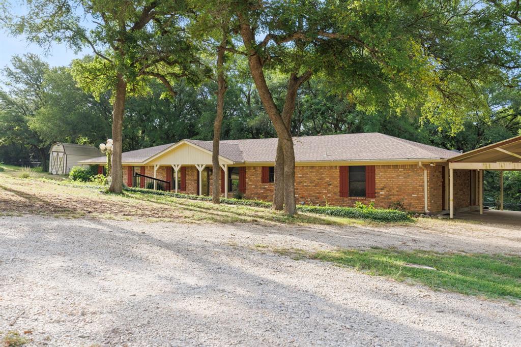 Spacious ranch on 7+ acres in Lorena. Here is your chance to own a classic ranch house on acreage in a location that offers an easy commute while preserving peaceful living.

This 2,700 sqft. house features four spacious bedrooms, two bathrooms, and two open living rooms offering flexibility and opportunity for creative renovations that cater to your style of living. The sheer size of this home offers a great space for hosting big gatherings or being creative with your room setup. Take a moment during your tour to step out back and take in the peaceful melody of an evening breeze rushing through the forest of tall beautiful trees scattered across the property. Parking isn't going to be a problem here. You have a detached two-car garage and a carport offering plenty of space for numerous personal and recreational vehicles.

This is a great opportunity to buy a value-add home in Lorena ISD with plenty of distance away from the future Hunter's Creek neighborhood. Land like this is only becoming more scarce as Waco continues to grow. Get it before it's gone!