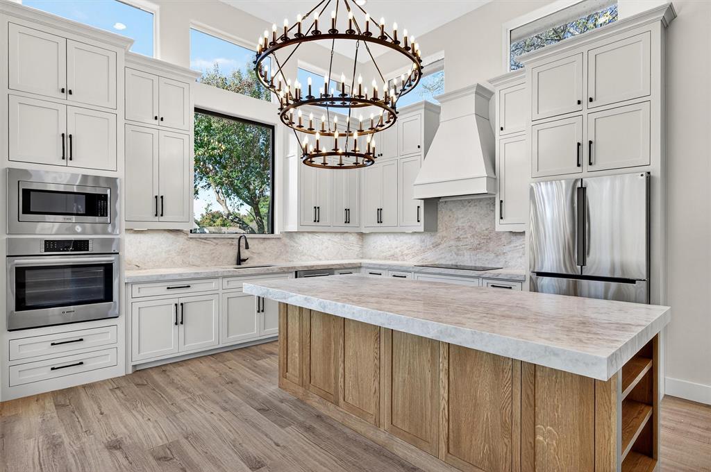 Welcome home to your private golf-course sanctuary, where modern architecture, panoramic views, and exceptional craftsmanship come together in one extraordinary new-construction residence. Perfectly positioned just two blocks from the lodge and pro shop, this home offers sweeping double fairway views of the 12th and 18th holes and breathtaking 180-degree lake vistas from the third floor. The main level showcases dramatic 14-foot ceilings, an abundance of natural light, and a chef-inspired gourmet kitchen designed for entertaining. The elegant primary suite features a spa-caliber bath, oversized closet, and a dedicated shoe room - a rare luxury. Upstairs, you’ll find four beautifully appointed bedrooms, each with its own en-suite bath, plus a large 960 sqft. climate-controlled storage area for ultimate convenience. The excitement continues on the third floor with a flexible game room-observatory suite complete with a 360-degree covered balcony, wet bar, and half bath. This is also an ideal space for a 6th bedroom, private retreat, or entertainment hub among the treetops. Sprayfoam encapsulation and argon filled windows make this home extremely energy efficient. The septic placement on the north side allows ample room for a future pool or expanded outdoor living area. Become part of the Lake Kiowa lifestyle, with a 24-hour manned security gate, roving patrol, and full access to community facilities included in your POA dues. Your custom lake-and-golf dream home awaits. Contact Brandon, your Lake Kiowa professional today. Disclosure: The last picture includes a rendering of a pool. Home does not include a pool.